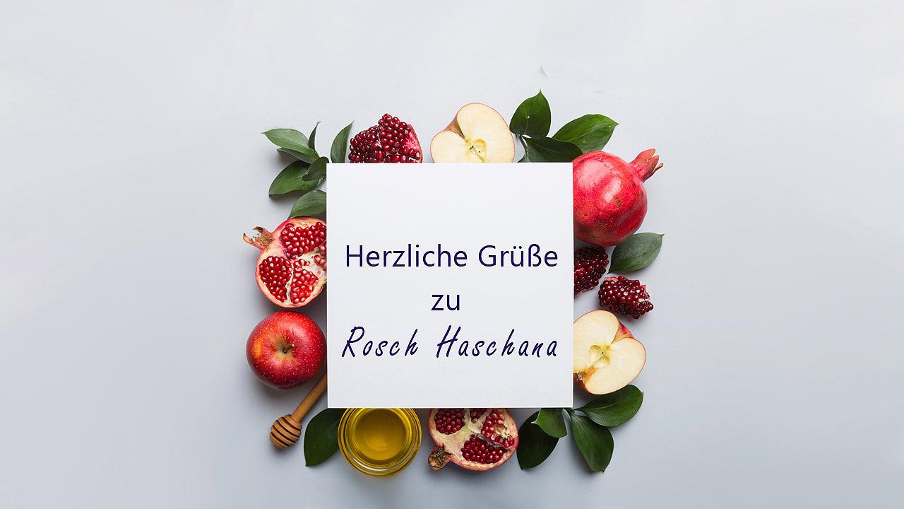 Honig, Äpfel, Granatäpfel, darüber eine Glückwunschkarte