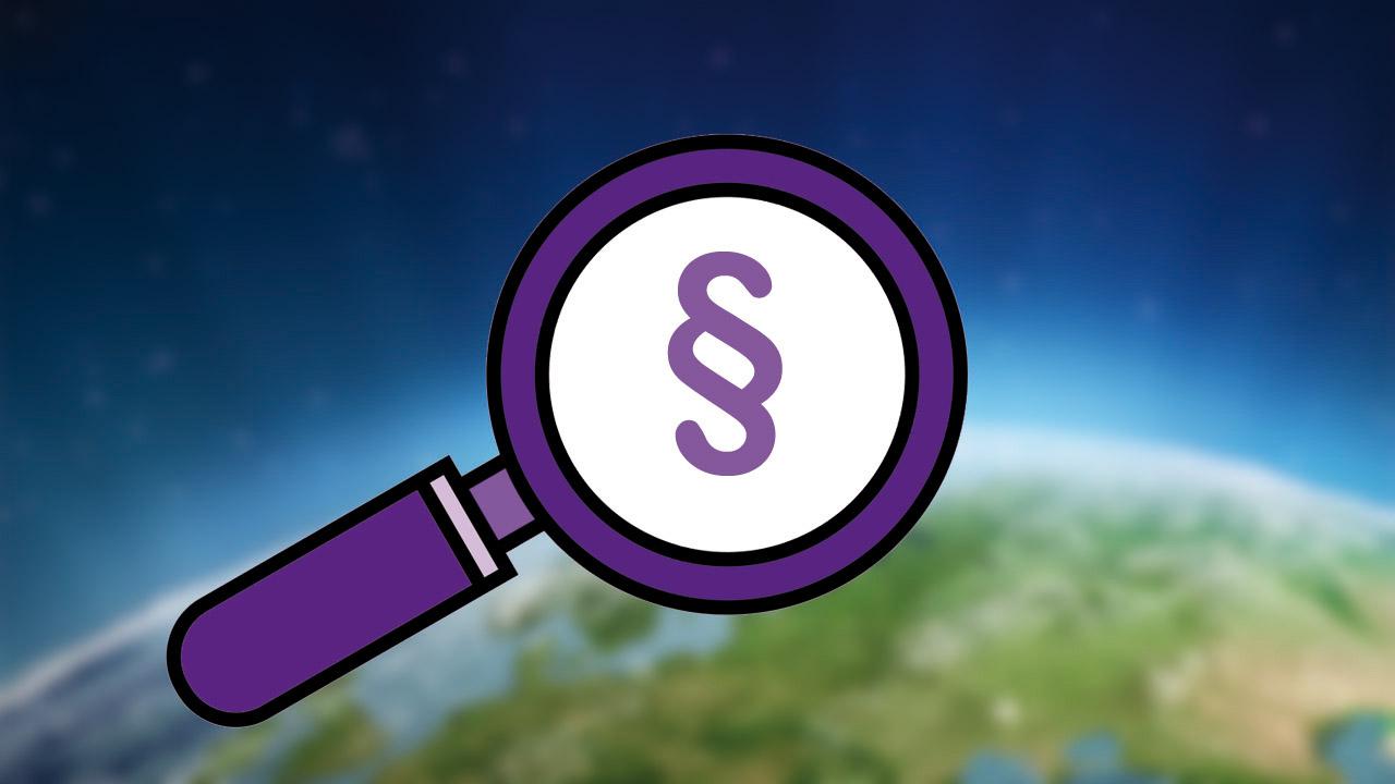 Lupe, unter der ein Paragraph zu sehen ist